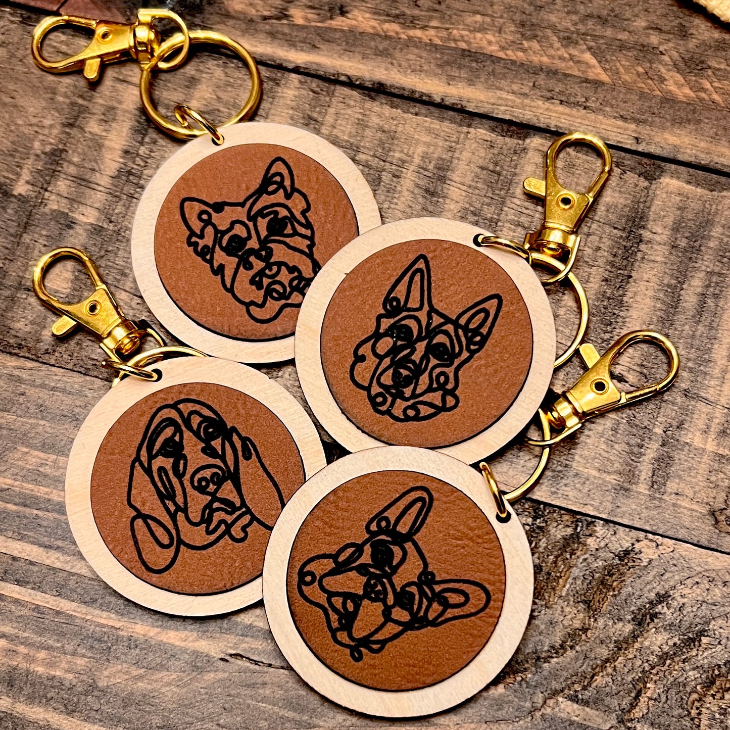 Keychains 
Featuring line art illustrations of your favorite dog breed. 🐾