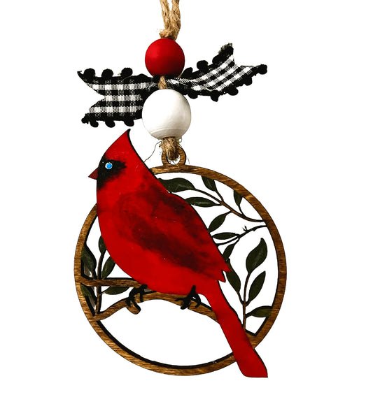 Cardinals represent hope for people mourning the loss of a loved one.  This beautiful memorial ornament is hand painted and laser cut out of wood. Due to the variances in wood grains no two ornaments are alike.  Hang it from a Christmas tree, rear view mirror or use as a gift tag.  